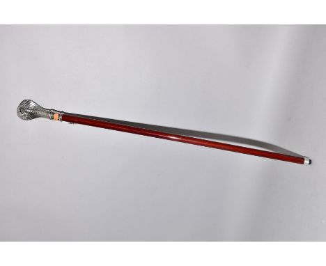 A MALACLEA TYPE WALKING STICK, with a white metal cobra handle, with faceted red glass eyes