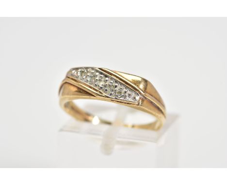 A 9CT GOLD DIAMOND RING, designed as a rectangle panel set with a diagonal row of single cut diamonds and crossover detail, w