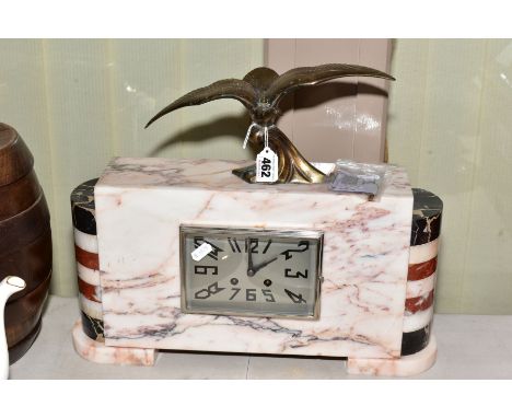A RECTANGULAR MARBLE ART DECO MANTLE CLOCK WITH BANDED HALF COLUMNS AT EITHER SIDE, a brass sea bird is mounted at the top, t