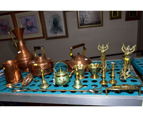 BRASS AND COPPER, to include brass and enamel teapot and bells, brass candlesticks, trivets, copper kettles, jug and tankard 