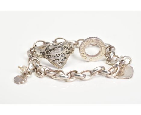 A THOMAS SABO BRACELET TOGETHER WITH A SILVER HEART SHAPED RING, the Thomas Sabo charm bracelet with a heart and four leaf cl
