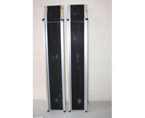 A PAIR OF ALUMINUM WHEELCHAIR RAMPS, inner width 15cm x length 108cm, together with a plastic folding walker