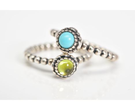 TWO PANDORA BIRTHSTONE RINGS, the first set with a central peridot cabochon, to the beaded shank, ring size L, together with 