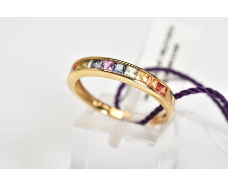 A 9CT GOLD SAPPHIRE RING, the half eternity style ring, set with a row of multi coloured princess cut sapphires, to the plain