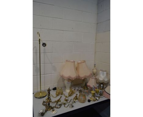 A QUANTITY OF VARIOUS LIGHT FITTINGS, to include a brassed triple branch light fitting with a glass shade, eight various tabl