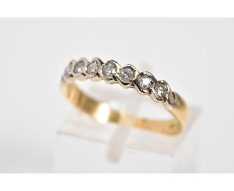 A DIAMOND HALF ETERNITY RING, set with a row of round brilliant cut diamonds, each within a crossover setting, to the plain p