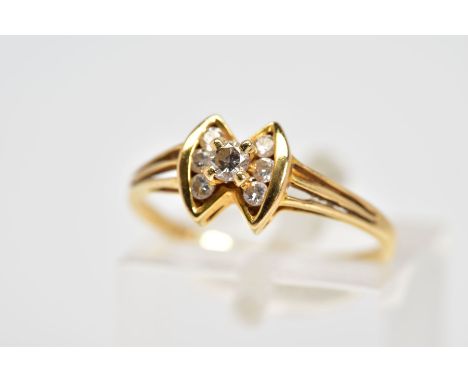 A MODERN DIAMOND DRESS RING, bow style to split shoulders, estimated total modern round brilliant cut weight 0.13ct, stamped 