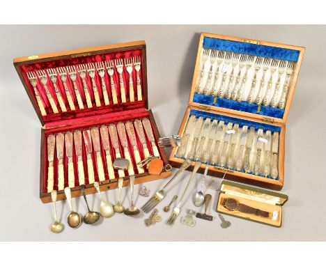 AN EDWARDIAN CASED SET OF TWELVE SILVER HANDLED DESSERT KNIVES AND FORKS, EPNS blades, one knife has replacement handles, (sh