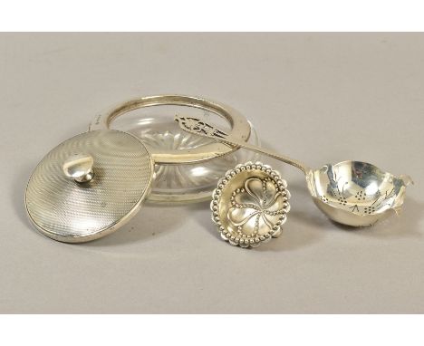 A GEORGE IV SILVER TEA STRAINER, foliate pierced handle, makers Viners, Sheffield 1939, 1.41ozt, 44 grams, together with a la