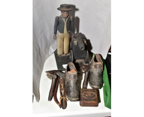 A PAIR OF EARLY VICTORIAN CHILDRENS SHOES, having wooden soles, with hob-nails and leather uppers, with decorative treen, a c