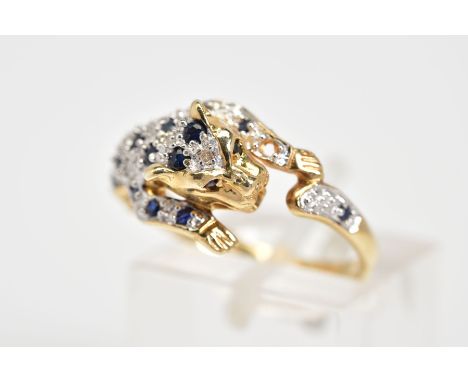 A 9CT GOLD SAPPHIRE AND DIAMOND RING, in the form of a leaping jaguar set with circular cut sapphires and single cut diamonds