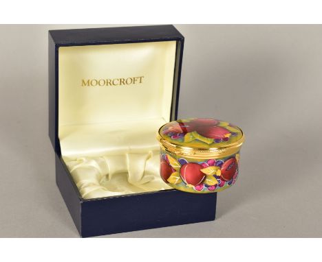 A MODERN BOXED MOORCROFT ENAMEL CIRCULAR PILL BOX, Pomegranate pattern, approximate diameter 6cm