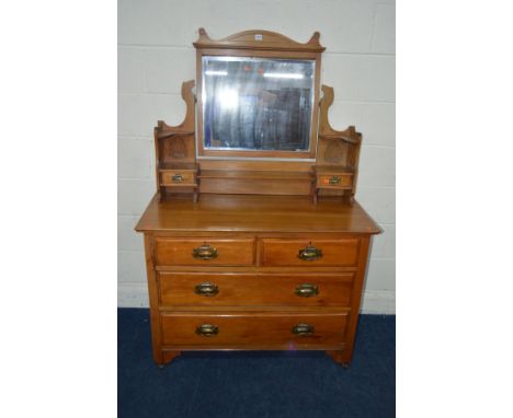 AN EDWARDIAN SATINWOOD DRESSING CHEST, a mirror centered with undershelf, flanked by a single drawer and corner shelf to each