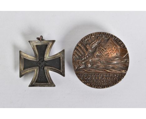 A GERMAN 3RD REICH WWII IRON CROSS 2ND CLASS, no ribbon, two piece construction, no makers mark on suspender ring evident, to