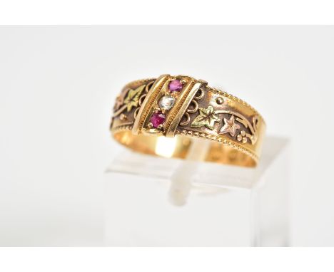 AN 18CT GOLD VICTORIAN RING, set with a diagonal row of two circular cut rubies interspaced by a single cut diamond, floral e