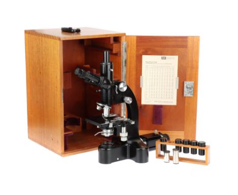 An Ernst Leitz Wetzlar, Dialux Trinocular Compound Microscope, German, signed to the body Ernst Leitz Wetzlar No. 540766 with
