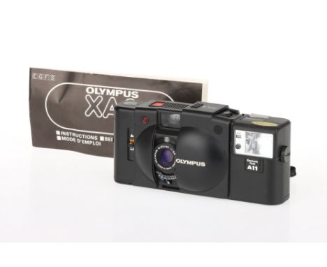 An Olympus XA2 Viewfinder Camera, black, body G, shutter &amp; flash working at time of auction, optics G, some light haze pr