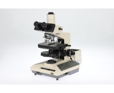 An Olympus BH-2 Microscope, Japan, c.1990, labeled to the front OLYMPUS BH-2, the microscope with a halogen lamp to the rear,