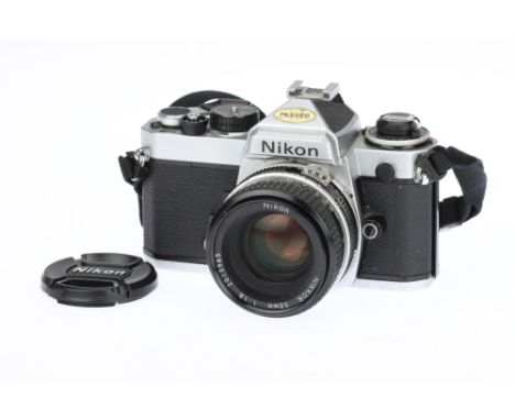 A Nikon FE 35mm SLR Camera, chrome, serial no. 4053513, body G, some light patina to body, shutter working when batteries are