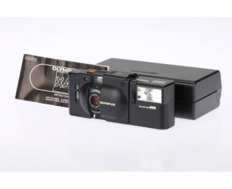 An Olympus XA 35mm Rangefinder Camera, black, body G, RF patch visible, shutter &amp; flash working at time of auction, optic