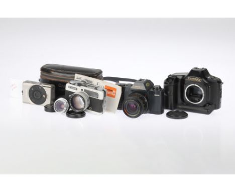 A Selection of Canon Items, to include a Canon T50, appears to work at time of auction, with Bell &amp; Howell f/2.8 28mm len