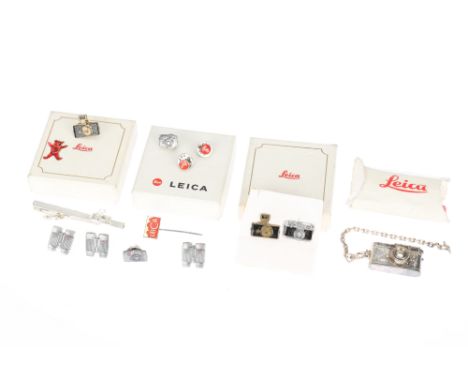 A Selection of Leica Pin Badges &amp; Accessories, to include a boxed Leica M6 key chain, a Leica O series tie pin, a Leica R