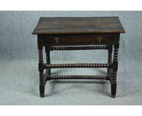 Side table, 18th century oak on stretchered bobbin turned supports. H.66 W.82 D.56cm. 
