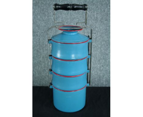 An old Tiffin box in a light blue finish with red edging. H.44 cm. 
