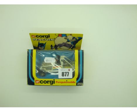 A Boxed Corgi 259 Penguin Mobile, box has tears, scratching, tape, model good condition but dusty.
