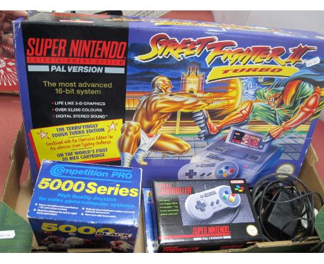 A Super Nintendo Entertainment System (SES) Street Fighter II Turbo Console Edition, boxed contents include console (signs of