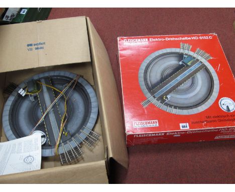 Two Fleischmann 'HO' Gauge Profi-Gleis Electric Turntables, one boxed (Ref No 6152C), one unboxed; both fair u/t condition.