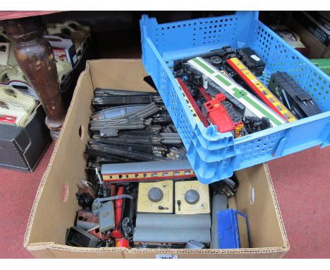 A Fair Quantity of Three Rail T.T.R Track, eleven items of rolling stock (includes three coaches); two controllers, two 0-4-0