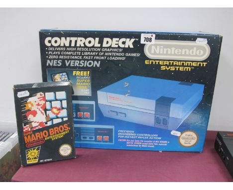 A Boxed Nintendo Entertainment System (NES) Control Deck, two hand held controllers, cables, instruction leaflet, Super Mario