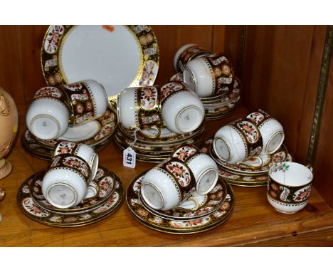 A LATE VICTORIAN FORTY THREE PIECE WEDGWOOD Y1123 PATTERN PART TEA SET, having a gilt dark brown border around floral panels 