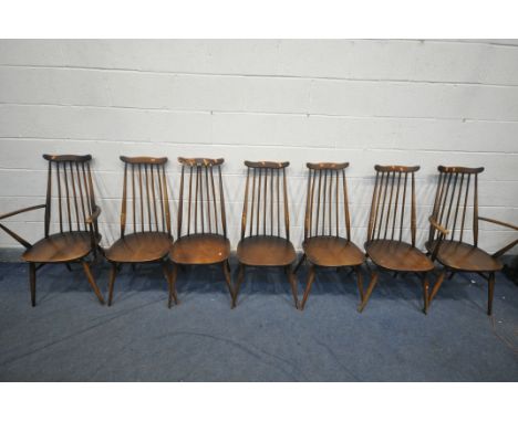 A SET OF SEVEN ERCOL ELM AND BEECH GOLDSMITH DINING CHAIRS, including two carvers (condition - ideal for restoration due to v
