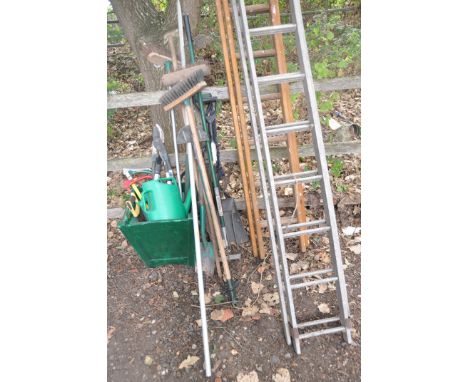 A LONG ALUMINIUM DOUBLE EXTENSION LADDER 4.1m long, a shorter wooden double extension ladder, a wooden planter, and some gard