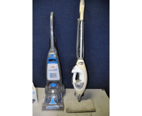 A VAX VRS7W CARPET CLEANER along with a Shark professional steam mop (model No unknown) (both PAT pass and working) and a box