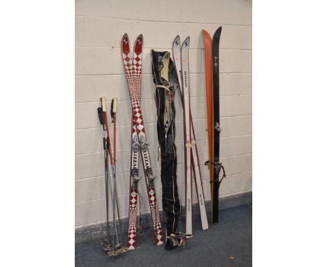 FOUR PAIRS OF SKI'S, brands include Head, Fischer and Blizzard along with nine ski sticks modern and vintage