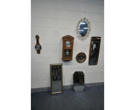 A MID CENTURY OAK CASED WALL CLOCK (winding key and pendulum) an oak barometer, along with a selection of mirrors, to include