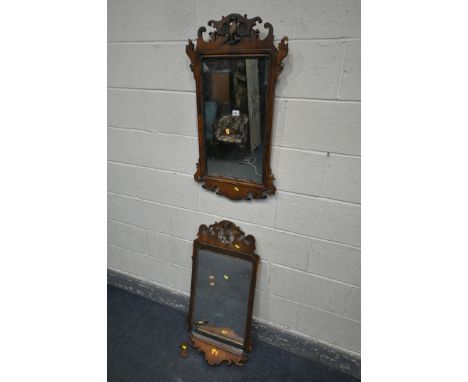 A 19TH CENTURY GEORGE II MAHOGANY FRETWORK WALL MIRROR, 48cm x 87cm (condition:-some veneer loss) and a similar distressed wa