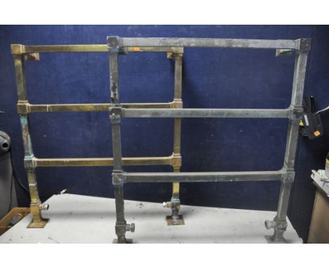 A PAIR OF VINTAGE BRASS WALL MOUNTED HEATED TOWEL RAILS, square design with three rails, along with another tubular floor mou