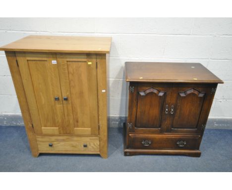 A REPRODUCTION OAK TWO DOOR MEDIA CABINET, made by 'the Royal oak furniture company', width 76cm x depth 46cm x height 81cm, 