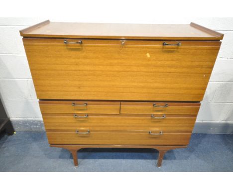 A MID CENTURY AFROMOSIA TEAK BUREAU, possibly McIntosh or Meredew, with a fall front door, enclosing a shaped shelf, over two