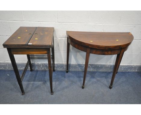 AN ARTS AND CRAFTS MAHOGANY WRITING DESK, with a fold over top that's enclosing a rise and fall desk organiser, and other des