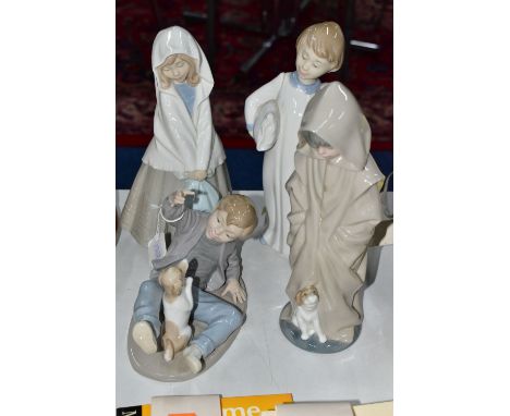 FOUR NAO FIGURES OF CHILDREN, comprising a boy with pillow and alarm clock (glued repair to the neck), girl wearing shawl and