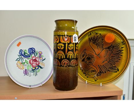 THREE PIECES OF POOLE POTTERY, comprising a cylindrical Aegean vase, height 30.5cm, diameter of rim 10.5cm, with printed mark