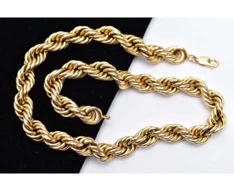 A YELLOW METAL NECKLACE, designed as a hollow rope twist chain, to the lobster clasp, stamped 14k, clasp stamped 750, width 1