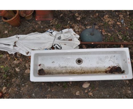 A LONG VINTAGE CERAMIC SINK 122cm long along with a large parasol with base advertising German beer (2)
