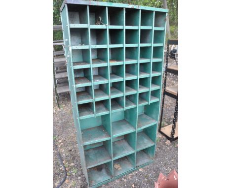 A VINTAGE METAL WORKSHOP PIDGEON HOLE SHELVING UNIT  with 36 small and 9 larger apertures width 92cm depth 30cm and height 18