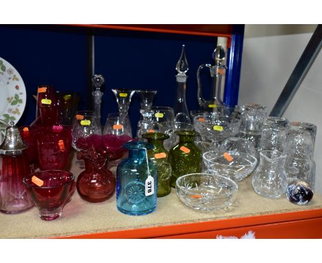 A COLLECTION OF COLOURED AND CLEAR GLASSWARE, including a pair of carafe and glass sets engraved with fuchsias and two other 